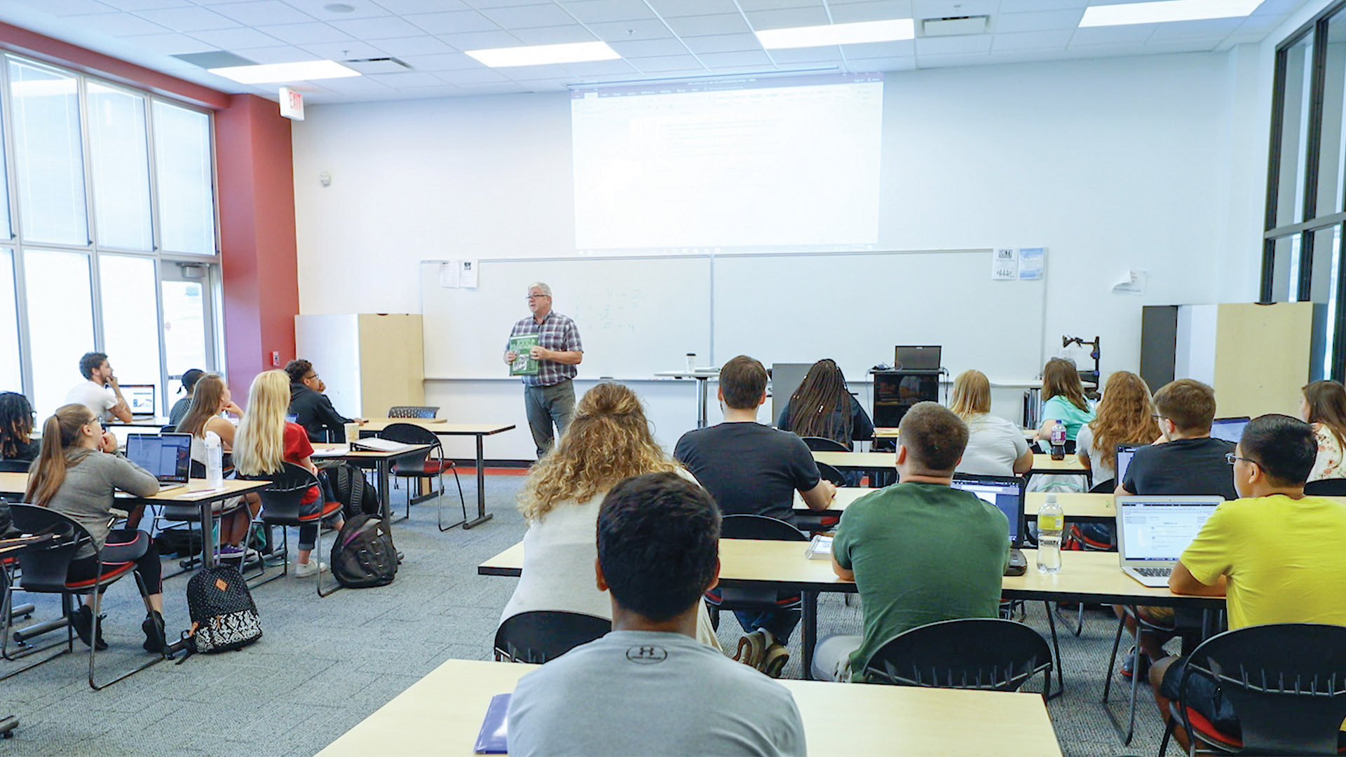 Students in class interacting with instructor.