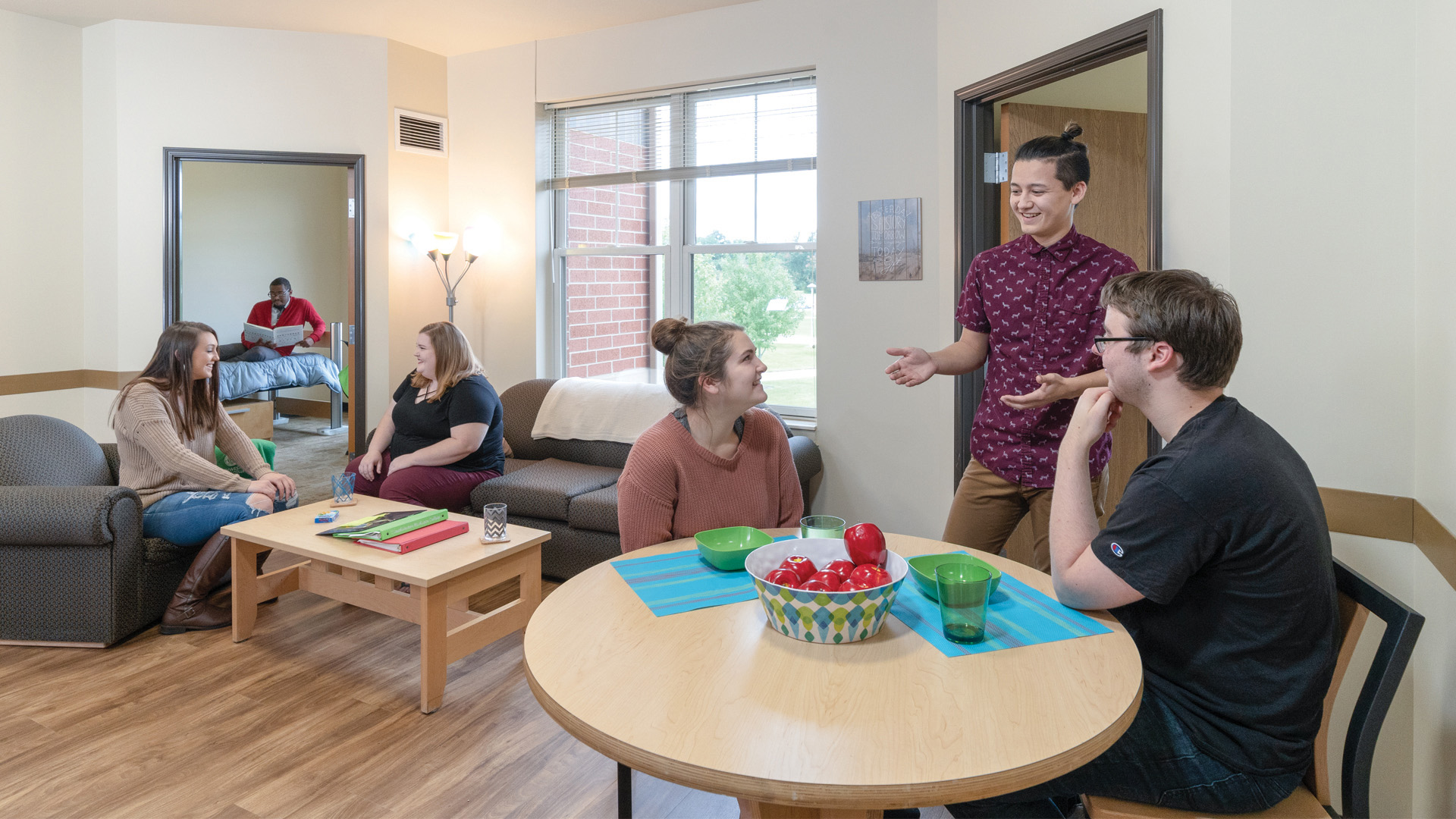 Students socializing in their livingroom area