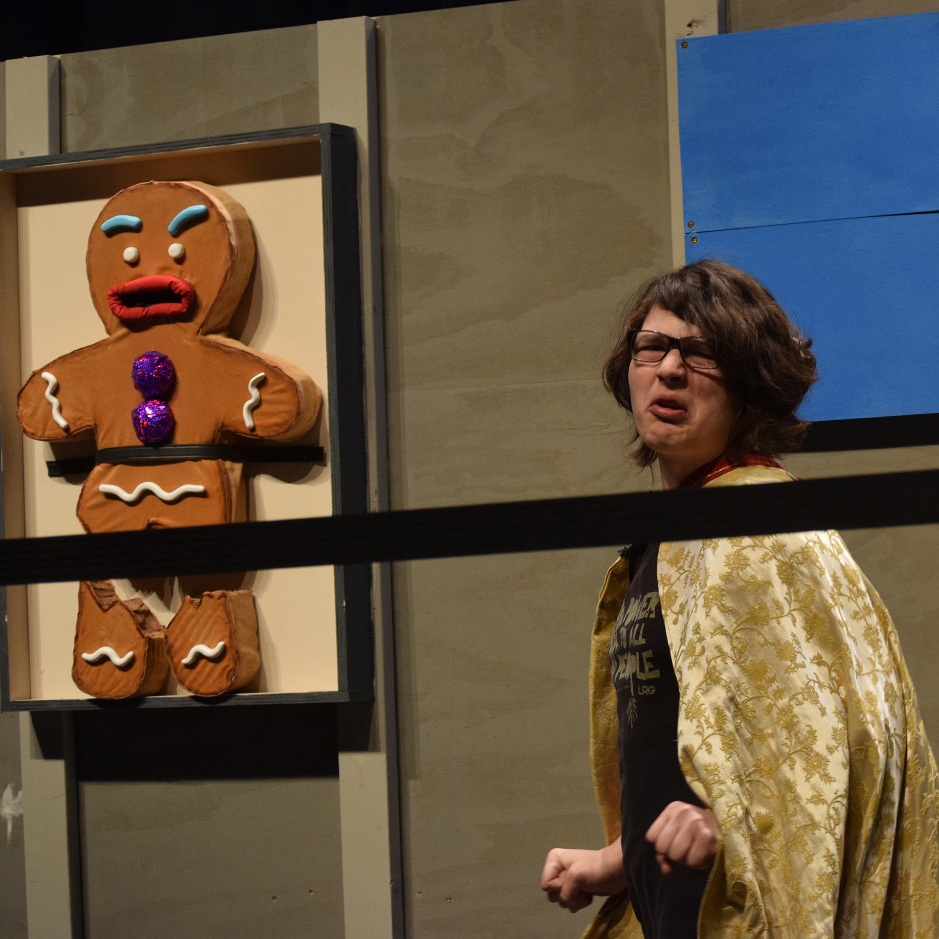 Brandon Maynard (Farquaad) torments the Gingerbread Man