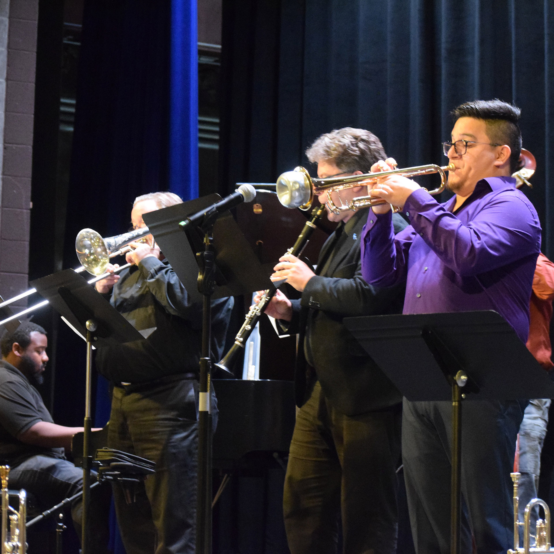 Friends materialized onstage in the Lyons theatre like a flash mob