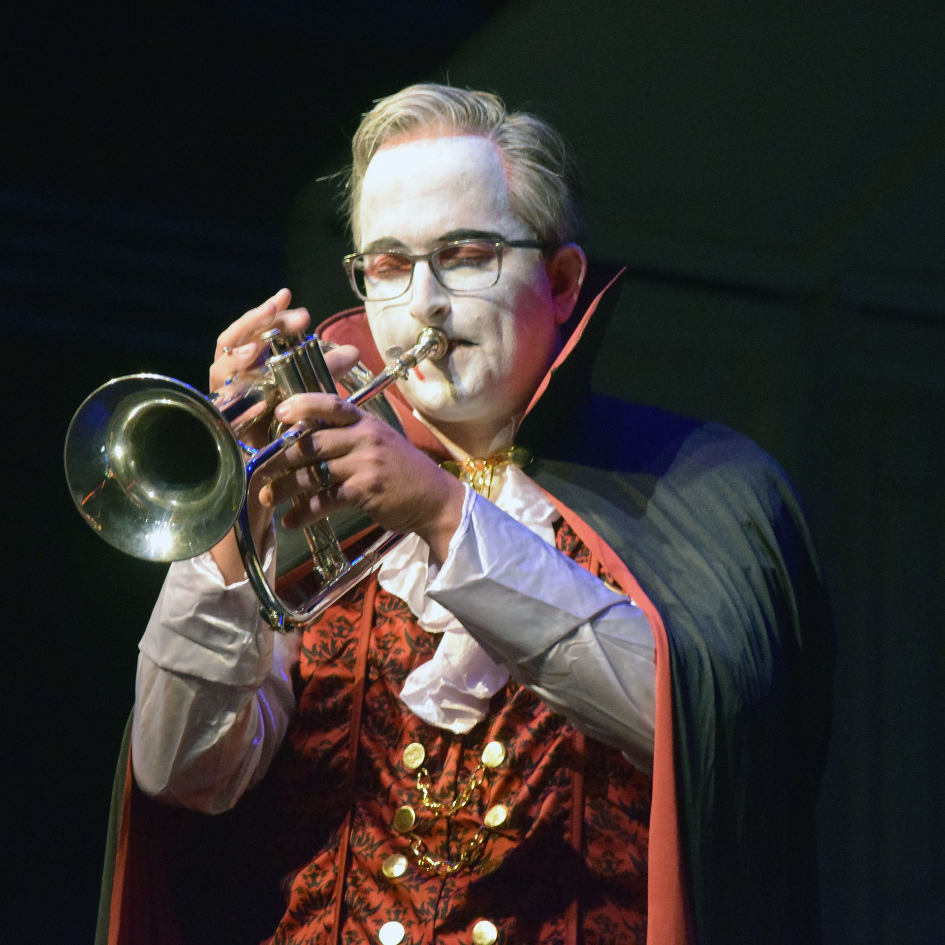 Director of Bands Mark Hollandsworth plays a trumpet solo as Count Dracula