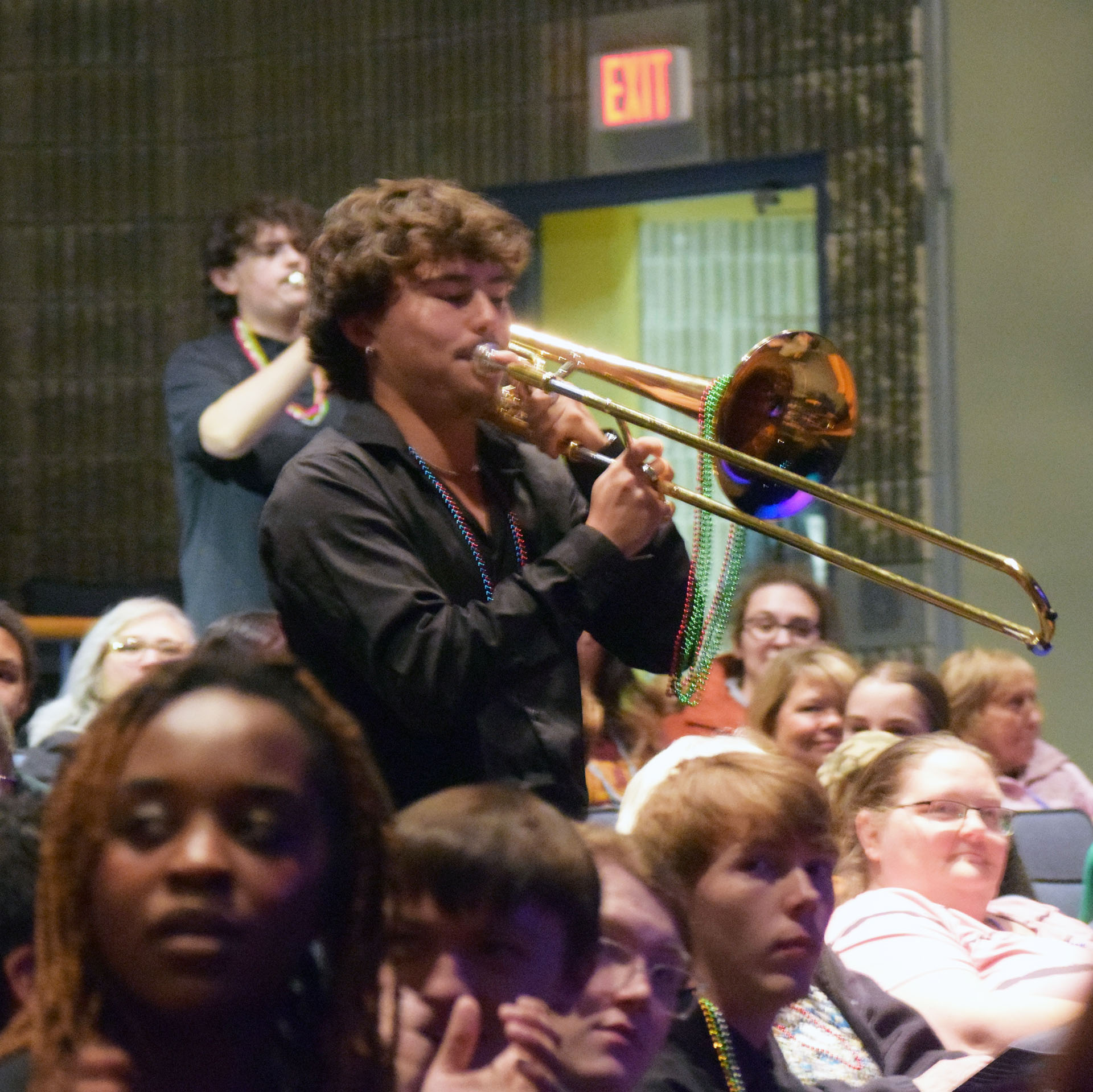 Musicians marched in New Orleans-style, laden with beads