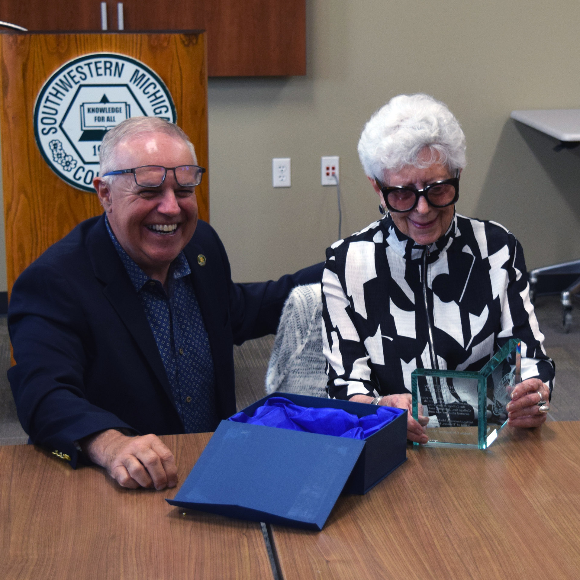 Chairman Jerdon presents her crystal book